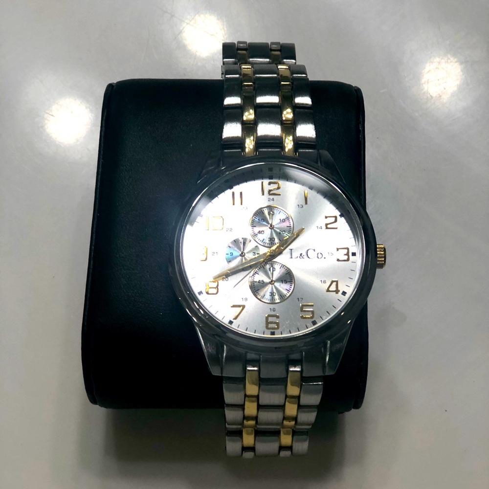 Brand New, in original box. L & Co unisex Watch.